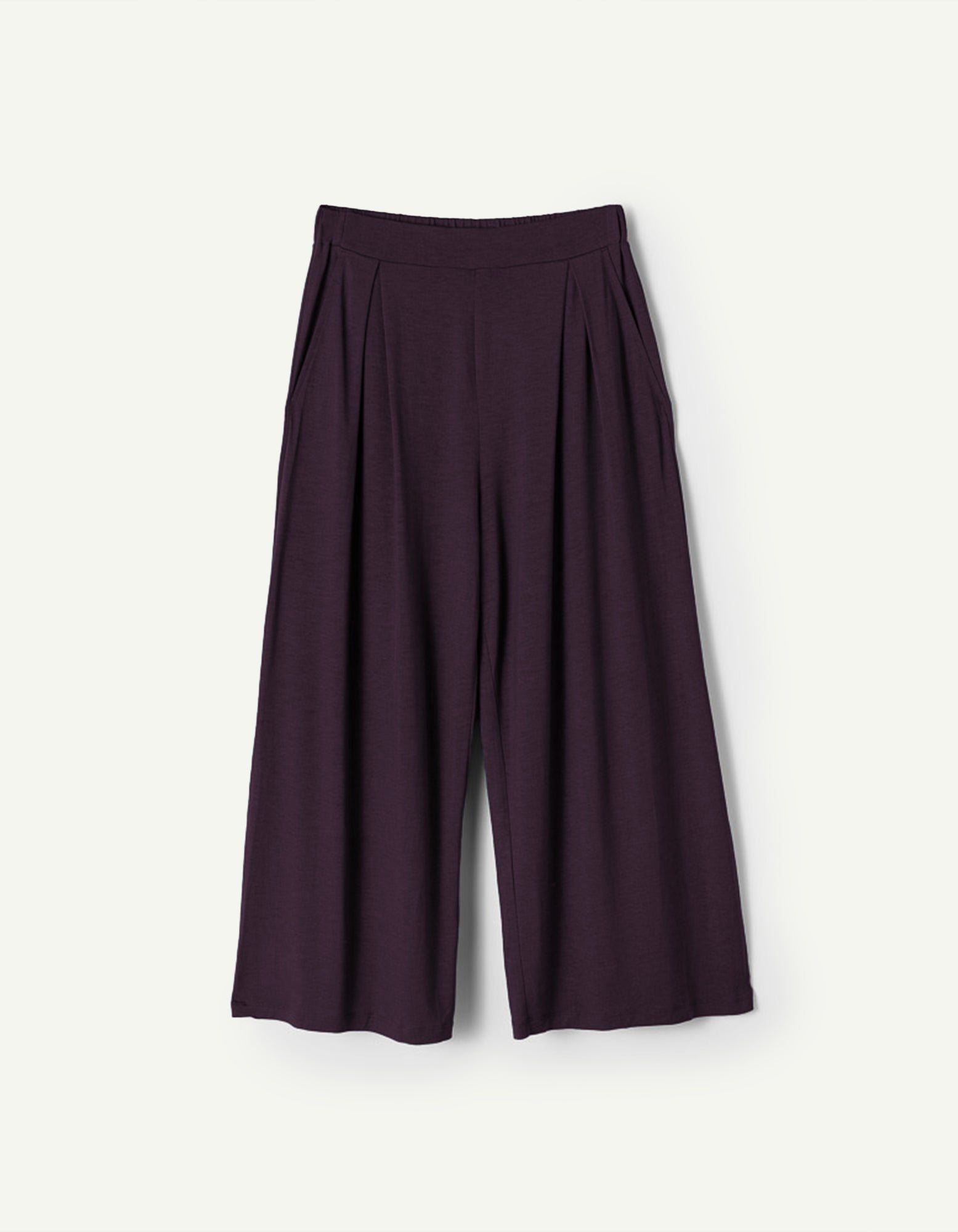 AWAN Flow Pants in Deep Plum, featuring a wide-leg design with pleats and a comfortable waistband. These stylish and versatile pants are made from soft, breathable fabric, perfect for both casual and formal wear.