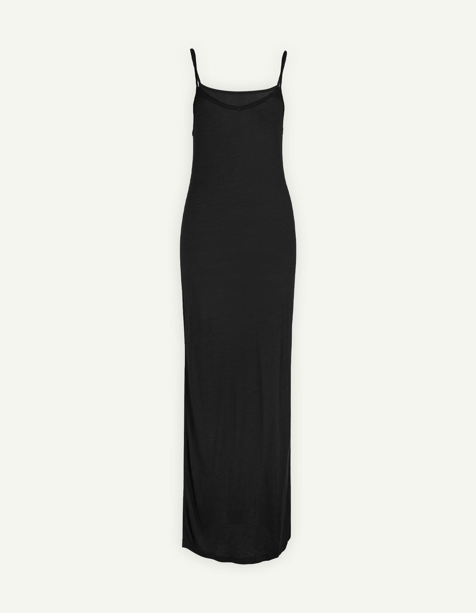 A sleek and elegant AWAN Maxi Slip Dress in warm black, featuring thin adjustable straps and a form-fitting silhouette that flows down to the ankles. This versatile piece is perfect for both casual and formal occasions.